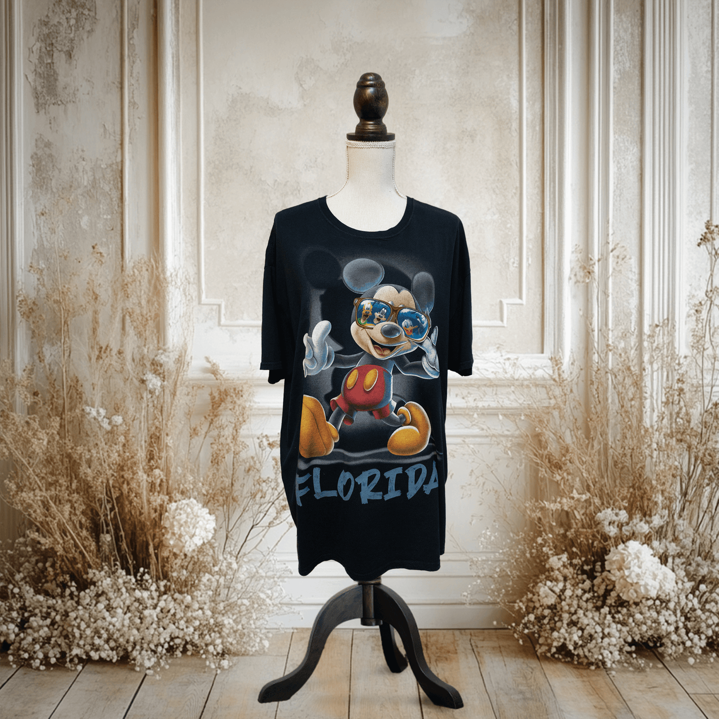 Black T-shirt featuring a stylish Mickey Mouse design with sunglasses and 'Florida' text, ideal for summer style.