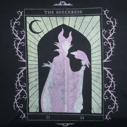 Illustration of a sorceress with a raven, featured on a black T-shirt design.