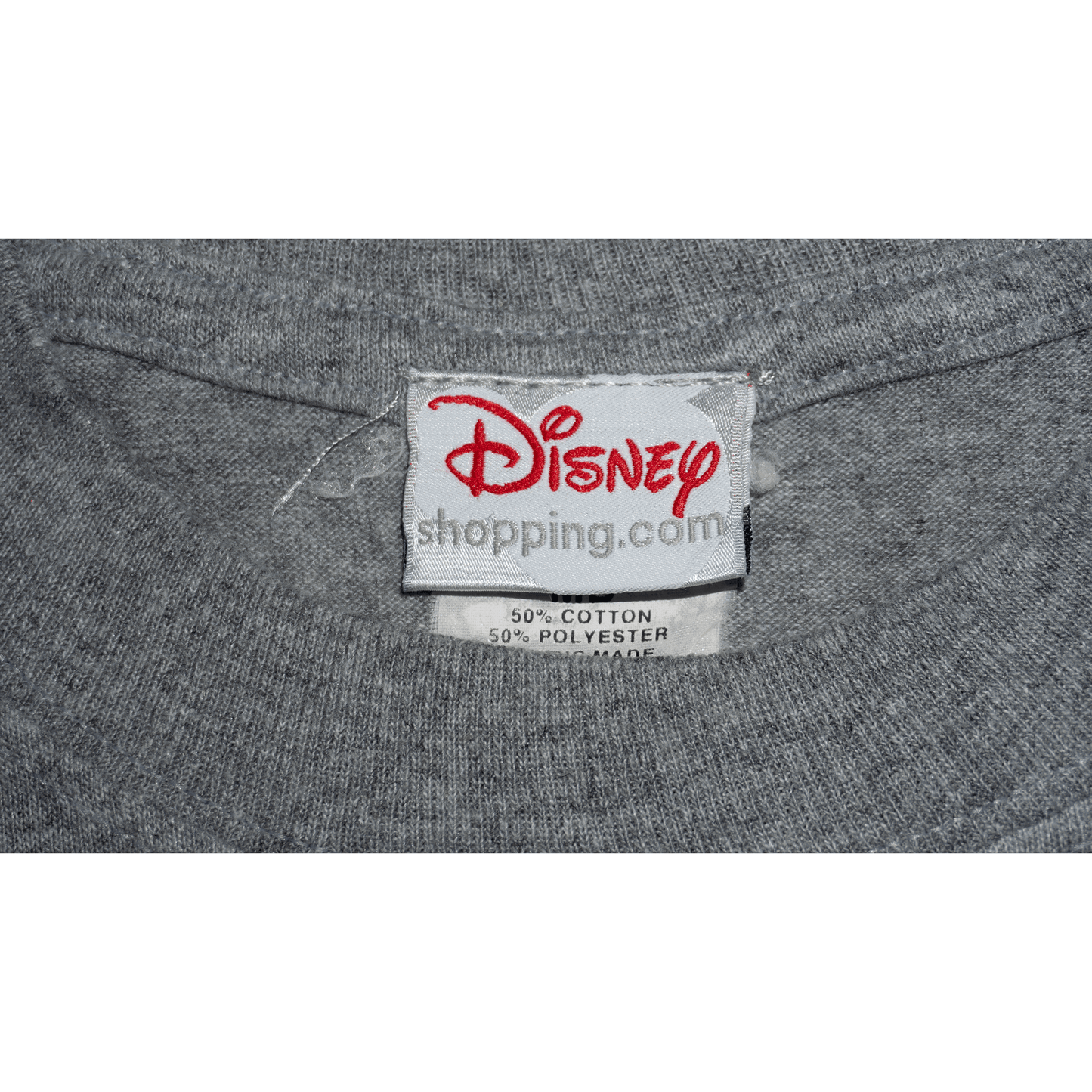 Disney label on a gray T-shirt made of 50% cotton and 50% polyester.